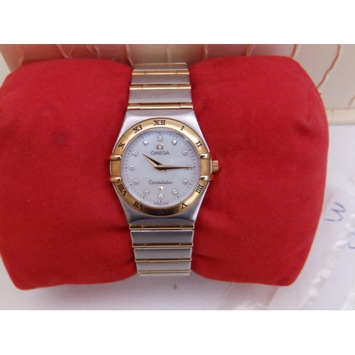 309 - A boxed lady's stainless steel & gold Omega Constellation bracelet wrist watch,  with mother-of-pear... 