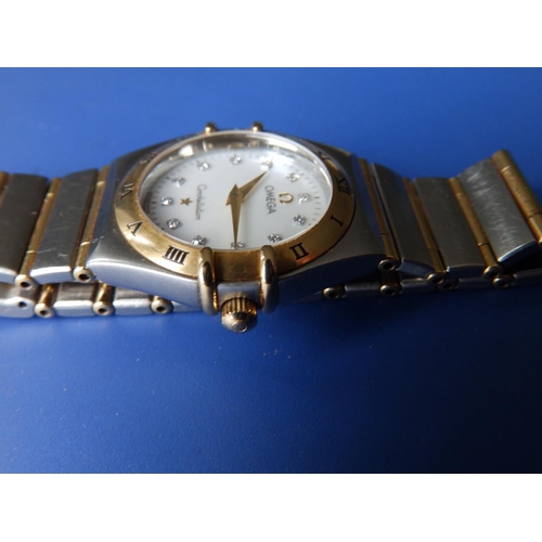 309 - A boxed lady's stainless steel & gold Omega Constellation bracelet wrist watch,  with mother-of-pear... 