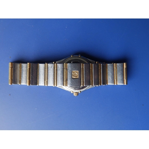 309 - A boxed lady's stainless steel & gold Omega Constellation bracelet wrist watch,  with mother-of-pear... 