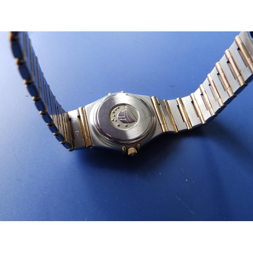 309 - A boxed lady's stainless steel & gold Omega Constellation bracelet wrist watch,  with mother-of-pear... 