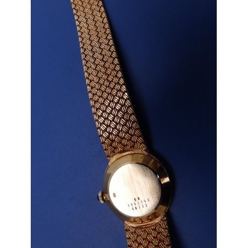 314 - A lady's diamond set 18ct gold Baume & Mercier Quartz bracelet wrist watch with oval gold dial, sapp... 