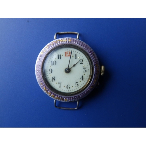 318 - An early 20thC enamelled silver wrist watch, case diameter 30mm - no strap.