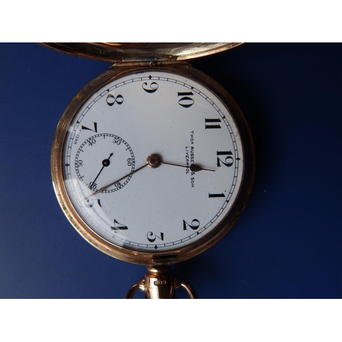 325 - A 9ct gold hunter cased pocket watch, the white enamel dial inscribed for 'Thos. Russell & Son, Live... 