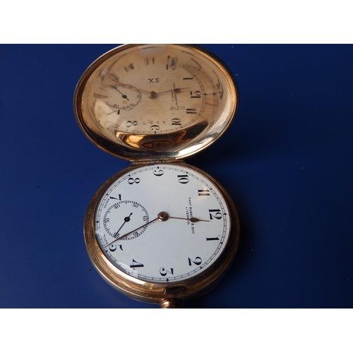 325 - A 9ct gold hunter cased pocket watch, the white enamel dial inscribed for 'Thos. Russell & Son, Live... 