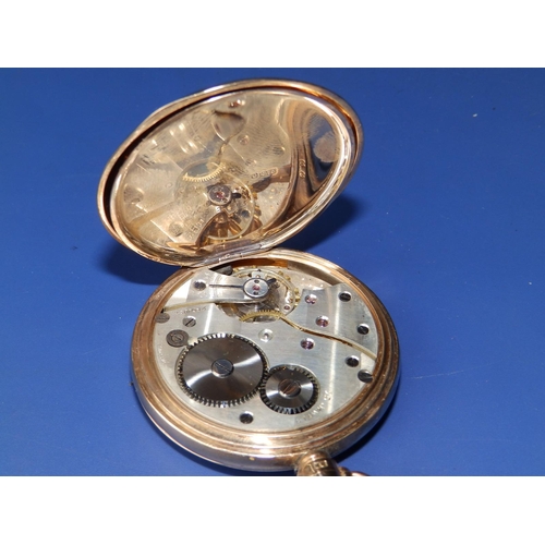 325 - A 9ct gold hunter cased pocket watch, the white enamel dial inscribed for 'Thos. Russell & Son, Live... 