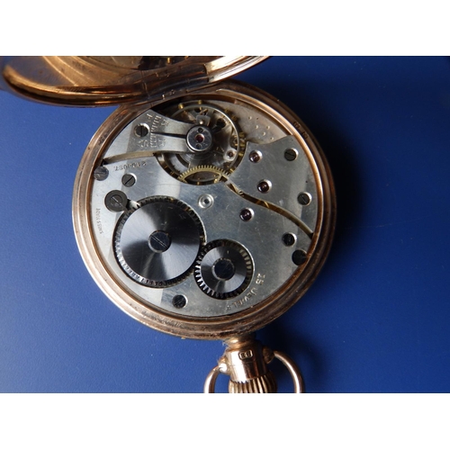 325 - A 9ct gold hunter cased pocket watch, the white enamel dial inscribed for 'Thos. Russell & Son, Live... 