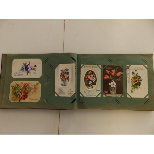 14 - An early 20thC postcard album containing approximately 150 cards.