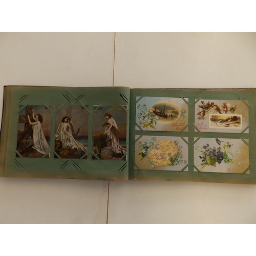 14 - An early 20thC postcard album containing approximately 150 cards.
