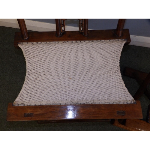 47 - A pair of Chinese folding chairs, having carved splats and footrests, Height 38