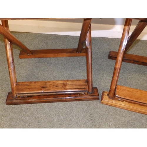 47 - A pair of Chinese folding chairs, having carved splats and footrests, Height 38