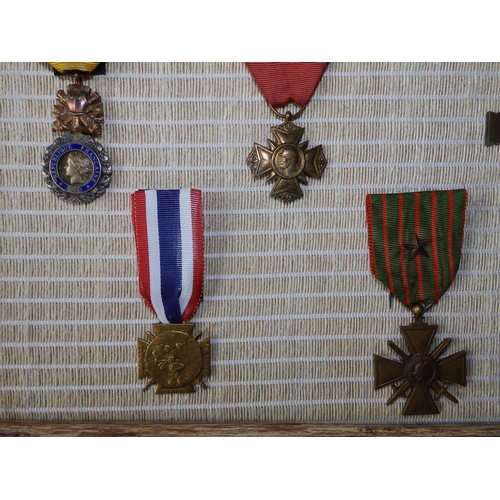 55 - Eight French WWI medals including the Croix De Guerre.