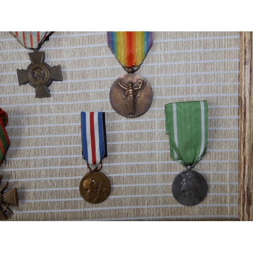 55 - Eight French WWI medals including the Croix De Guerre.