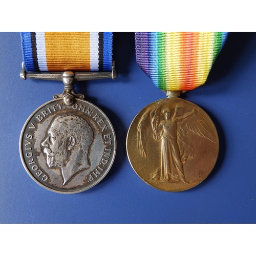 56 - A WWI medal pair awarded to 38703 Pte. H. Webber, Devon Regiment. (2)