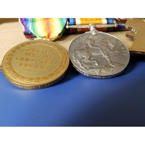 58 - A WWI medal trio including the 1914-15 Star with ribbon bar awarded to 13920 Pte. J. Havard, Devon R... 