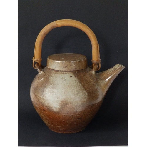 29 - A saltglazed studio teapot with tapering spout, U-shaped bamboo handle - 'HC?' monogram,  7.5