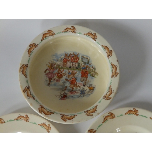 31 - A Royal Doulton Bunnikins baby's bowl decorated with a skating scene and two Bunnikins plates - a/f.... 