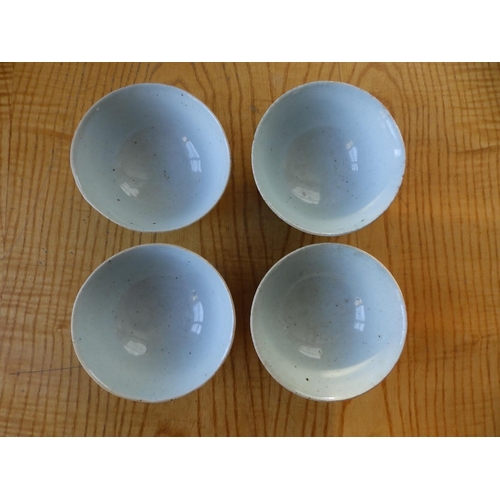 32 - A set of four Oriental celadon glazed bowls, 4.4