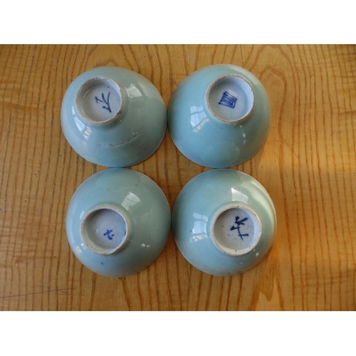 32 - A set of four Oriental celadon glazed bowls, 4.4