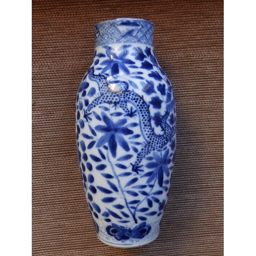 35 - A 19thC Chinese blue & white porcelain vase decorated with confronting dragons against flowering fol... 