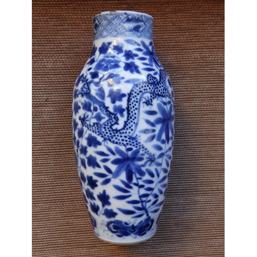 35 - A 19thC Chinese blue & white porcelain vase decorated with confronting dragons against flowering fol... 