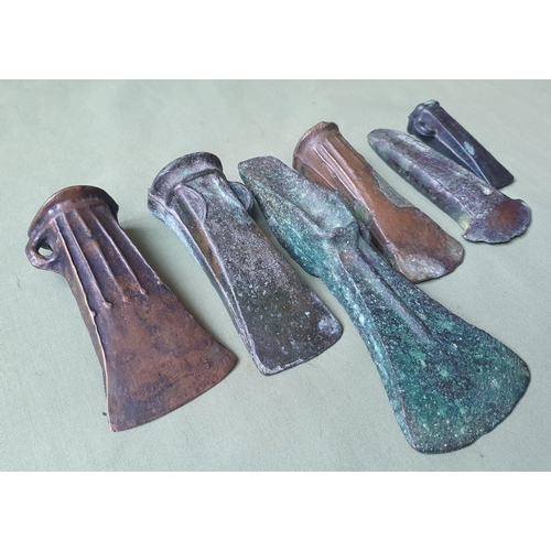 63 - A collection of UK found Bronze Age axes, the longest 6.5