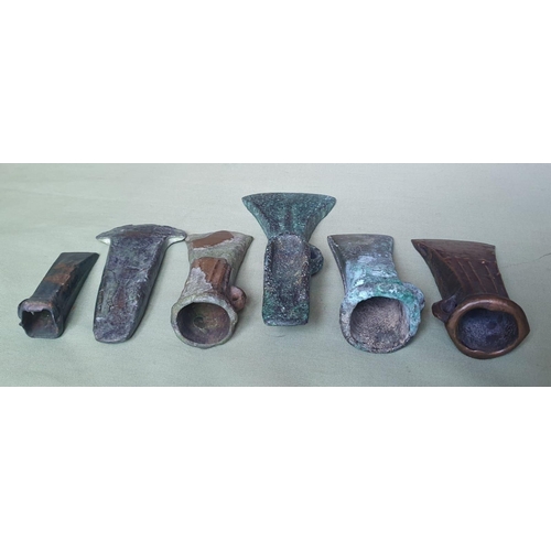 63 - A collection of UK found Bronze Age axes, the longest 6.5