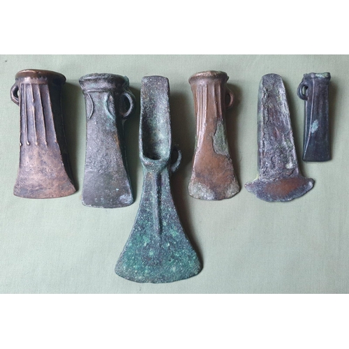 63 - A collection of UK found Bronze Age axes, the longest 6.5