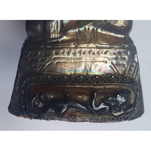 57 - A small Asian Buddha in silver overlaid with a Chinese brown jade panel, 3.5