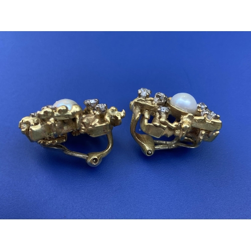 295 - A pair of 1970's certified natural saltwater pearl & diamond set clip-on earrings in yellow metal, o... 