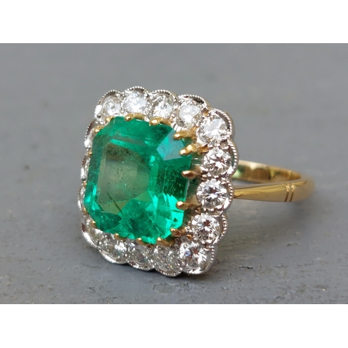 298 - A large rectangular emerald & diamond cluster ring, on yellow '18ct shank.  Finger size P/Q.