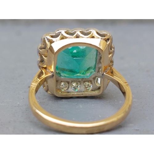 298 - A large rectangular emerald & diamond cluster ring, on yellow '18ct shank.  Finger size P/Q.