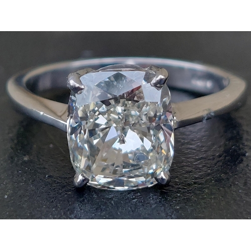 305 - A certified cushion cut diamond solitaire ring, the four-claw set stone weighing 3.71 carats, on whi... 