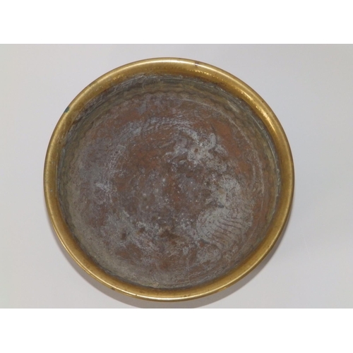 105 - An Eastern brass bowl decorated stylised script to sides, cockerels to undersides, 7.5