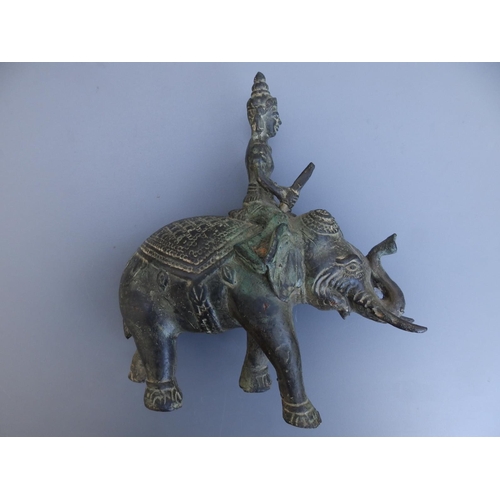 111 - An Indian bronze elephant with rider, 7.75