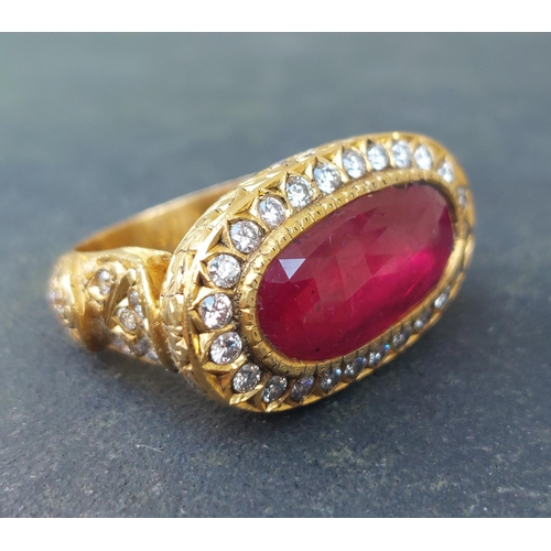 297 - A large antique style oval natural ruby & diamond cluster ring in 18ct gold, the faceted ruby weighi... 