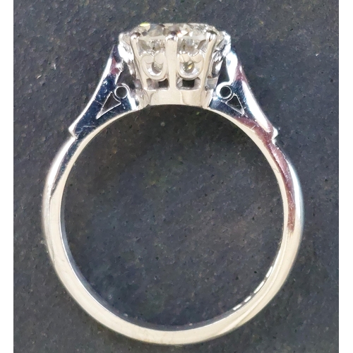 301 - A diamond solitaire ring, the claw set brilliant cut stone weighing approximately 1.65 carats, on 18... 