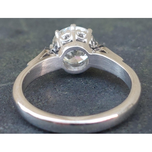 301 - A diamond solitaire ring, the claw set brilliant cut stone weighing approximately 1.65 carats, on 18... 