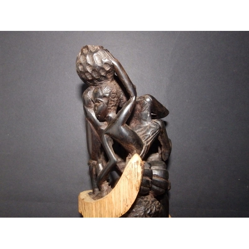 125 - A 20thC  Makonde Tree of Life ebony carving, 15.25