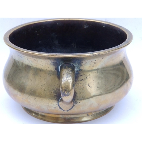 152 - A Chinese bronze two-handled censer, the underside cast with six character reign mark within a drago... 