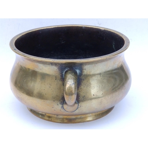 152 - A Chinese bronze two-handled censer, the underside cast with six character reign mark within a drago... 