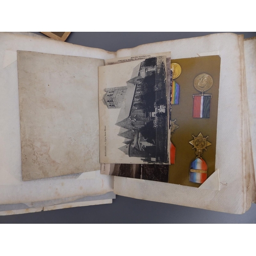 18a - A postcard album containing WWI military themes together with a Military Visitors' Signing In Book -... 