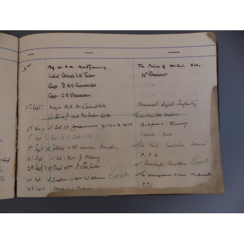 18a - A postcard album containing WWI military themes together with a Military Visitors' Signing In Book -... 