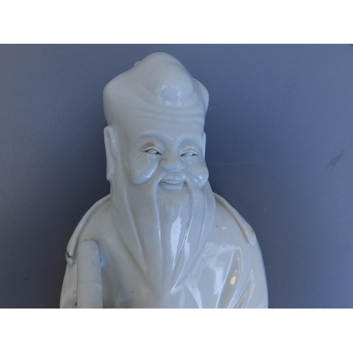 43 - An 18thC Chinese blanc-de-chine figure depicting the God of Longevity, 9.5