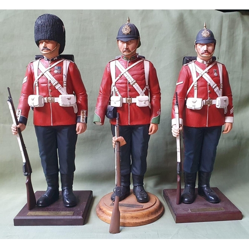 122 - Three military resin figures - one arm detached, 13