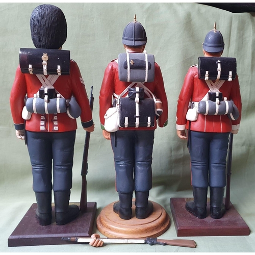 122 - Three military resin figures - one arm detached, 13