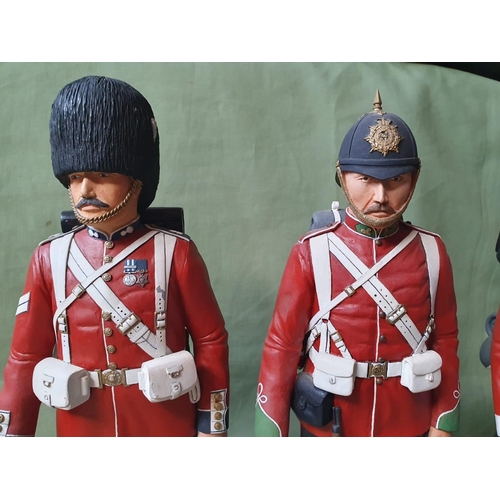 122 - Three military resin figures - one arm detached, 13