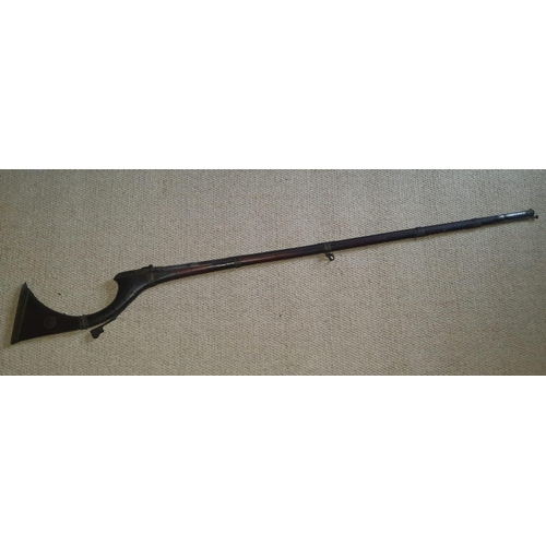 123 - An Arab Jezail long gun, the wooden stock with well decorated mounts, silver inlay to barrel, 63