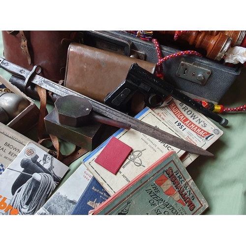 125b - A large collection of military and related items including a set of Scottish bagpipes.