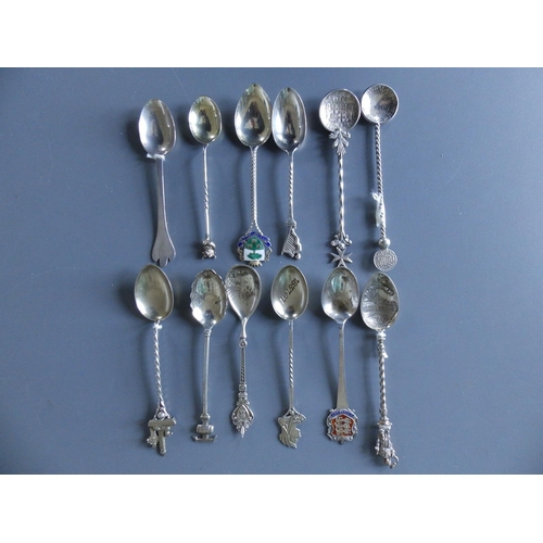 157 - 12 assorted silver teaspoons.