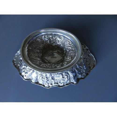 164 - A late Victorian silver repousse canoe-shaped silver pedestal bowl - Mappin Brothers, London 1897,  ... 